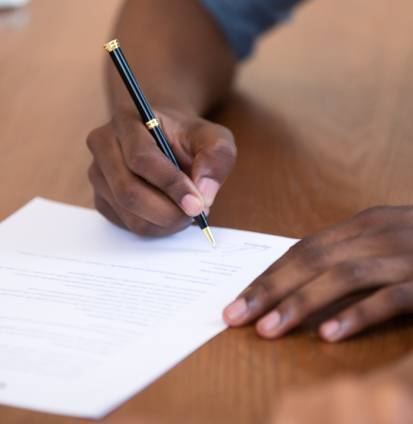 Close,Up,African,American,Man,Signing,Contract,,Job,Agreement,,Male